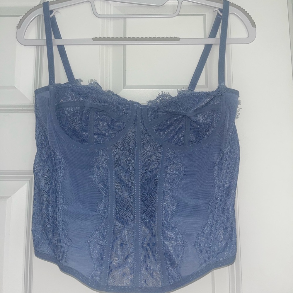 Blue, sheer, lace corset going out top.